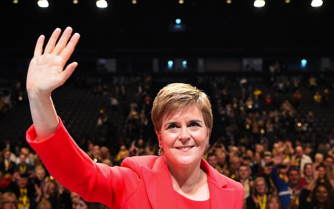 Nicola Sturgeon waves as she leaves the stage after delivering her speech to delegates at the annual SNP Co<em></em>nference in Aberdeen
